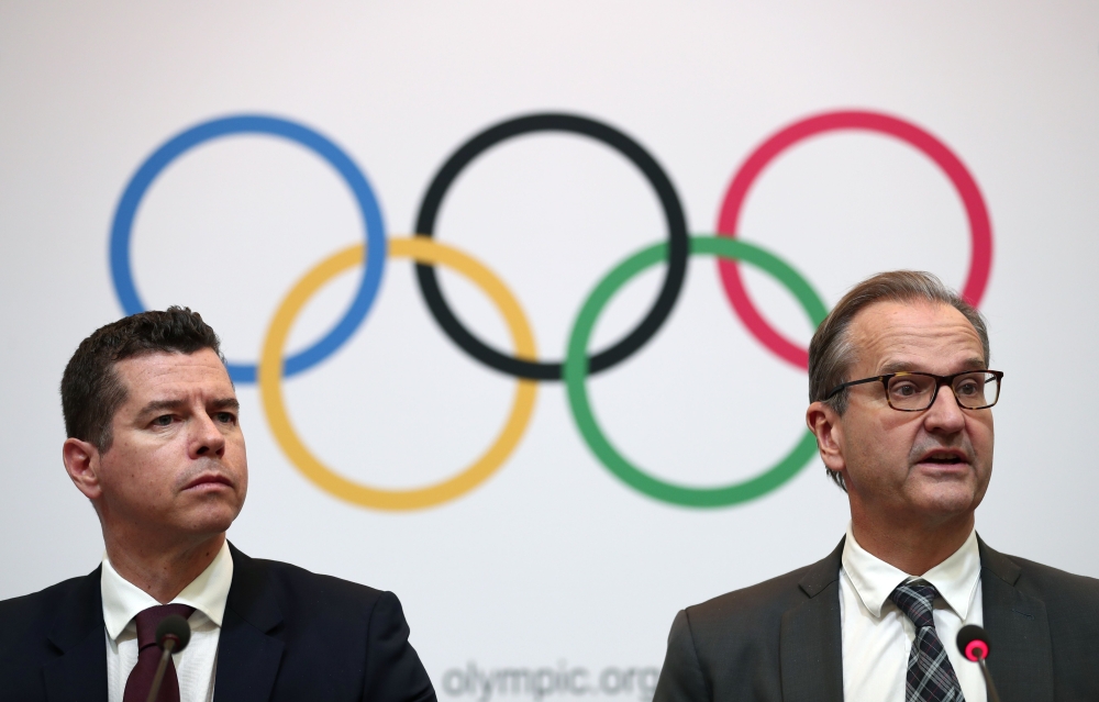 International Olympic Committee (IOC) sports director Kit McConnell (L) and spokesperson Mark Adams (R) attend a press conference in Tokyo on November 30, 2018. AFP / Behrouz Mehri
 