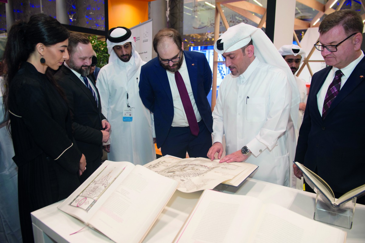 Acting CEO of Qatar Museums , Ahmad Musa Al Namla (second right) and Deputy Minister of Culture and National Heritage of the Republic of Poland, Pawel Lewandowski (third right) looking at the manuscript.