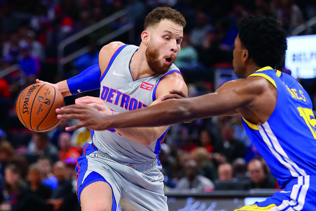 Blake Griffin #23 of the Detroit Pistons drives around Damian Jones #15 of the Golden State Warriors during the second half at Little Caesars Arena on December 01, 2018 in Detroit, Michigan. Gregory Shamus/Getty Images/AFP