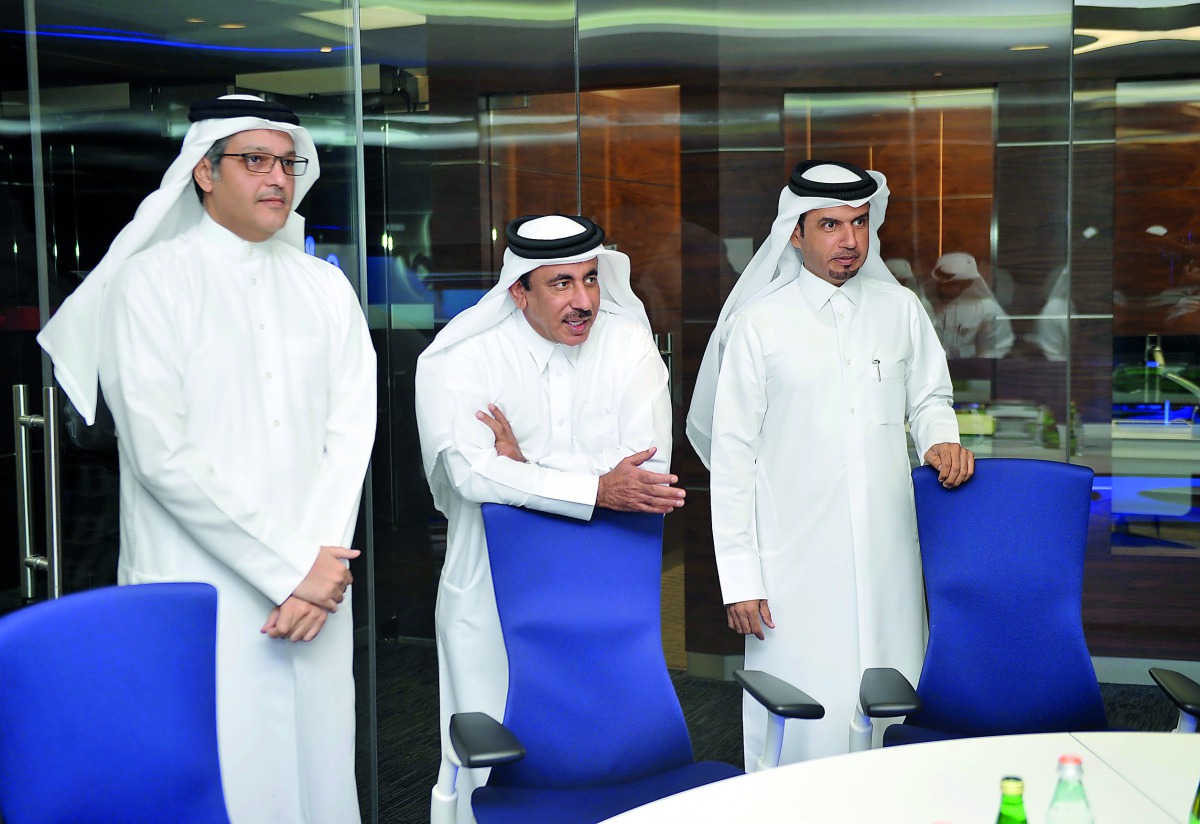 Minister of Transport and Communications H E Jassim bin Saif Al Sulaiti (centre) with other officials at QNBN Headquarters yesterday. Pic: Abdul Basit / The Peninsula