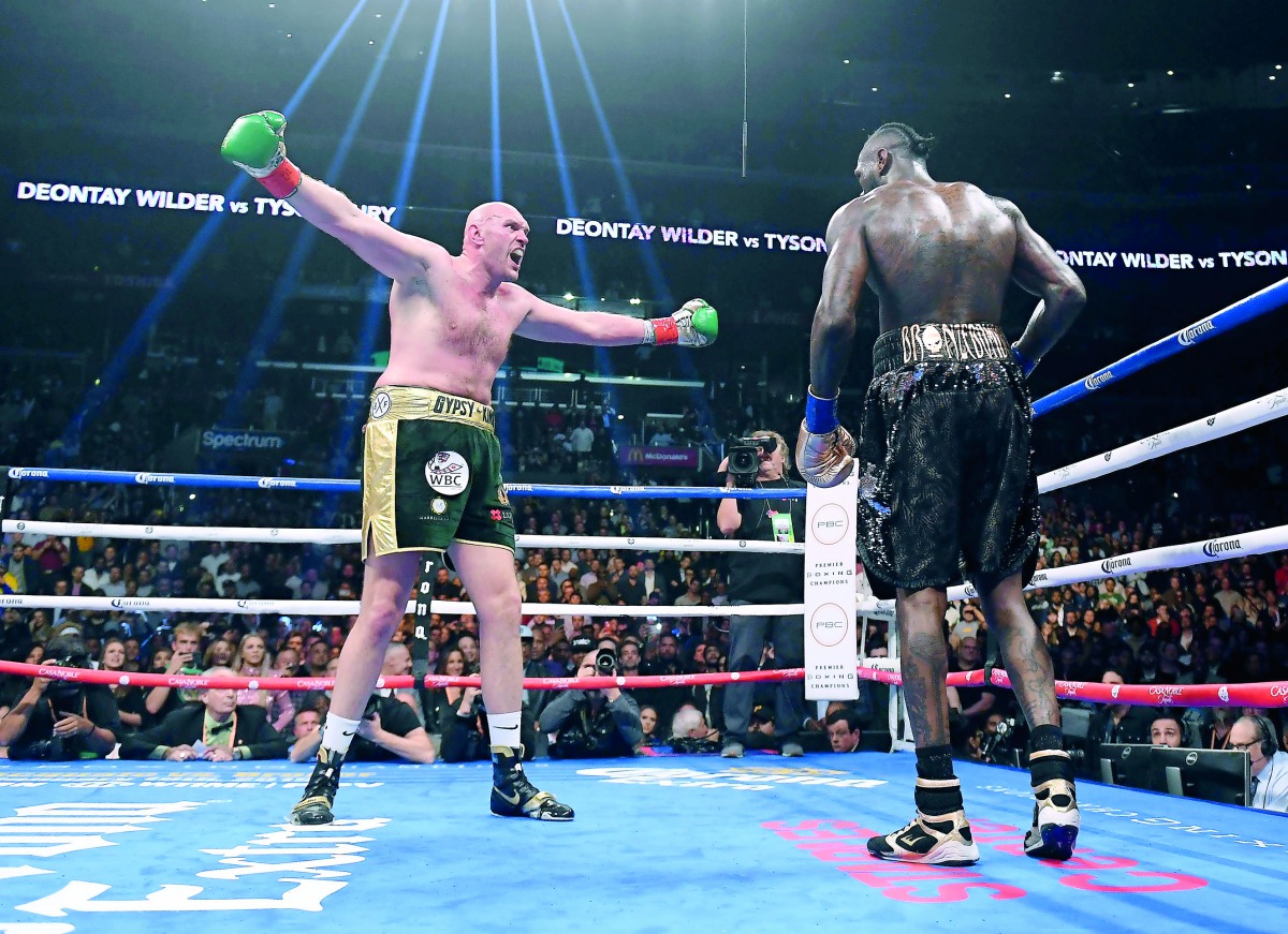 Tyson Fury (L) taunts Deontay Wilder in the ninth round fighting in their WBC Heavyweight Champioinship fight at Staples Center in Los Angeles, on December 1, 2018 AFP / Getty Images North America / Harry How


