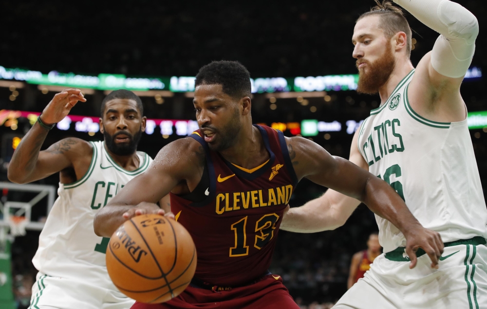 Cleveland Cavaliers center Tristan Thompson (13) works the ball against Boston Celtics guard Kyrie Irving (11) and center Aron Baynes (46) in the second quarter at TD Garden. Credit: David Butler II-USA Today Sports 