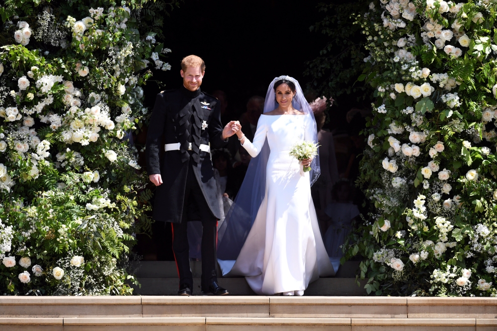 Prince Harry and Meghan Markle leave St George's Chapel at Windsor Castle after their wedding. Saturday May 19, 2018. Neil Hall/ via Reuters