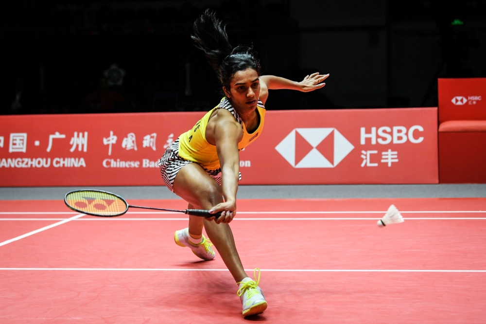 Sindhu Pusarla of India hits a return against Ratchanok Intanon of Thailand during their women's singles semi-final match at the 2018 BWF World Tour Finals badminton competition in Guangzhou in southern China's Guangdong province on December 15, 2018. (AF