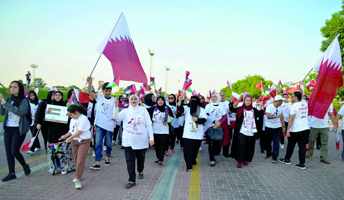 People from differents walks of life participate in Friendship Parade at Aspire Park yesterday. Pic: Abdul Basit / The Peninsula 