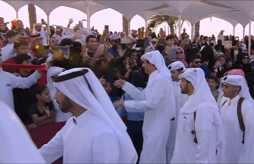 Amir H H Tamim bin Hamad Al Thani greets people gathered in Doha Corniche to watch Qatar National Day parade (screengrab)