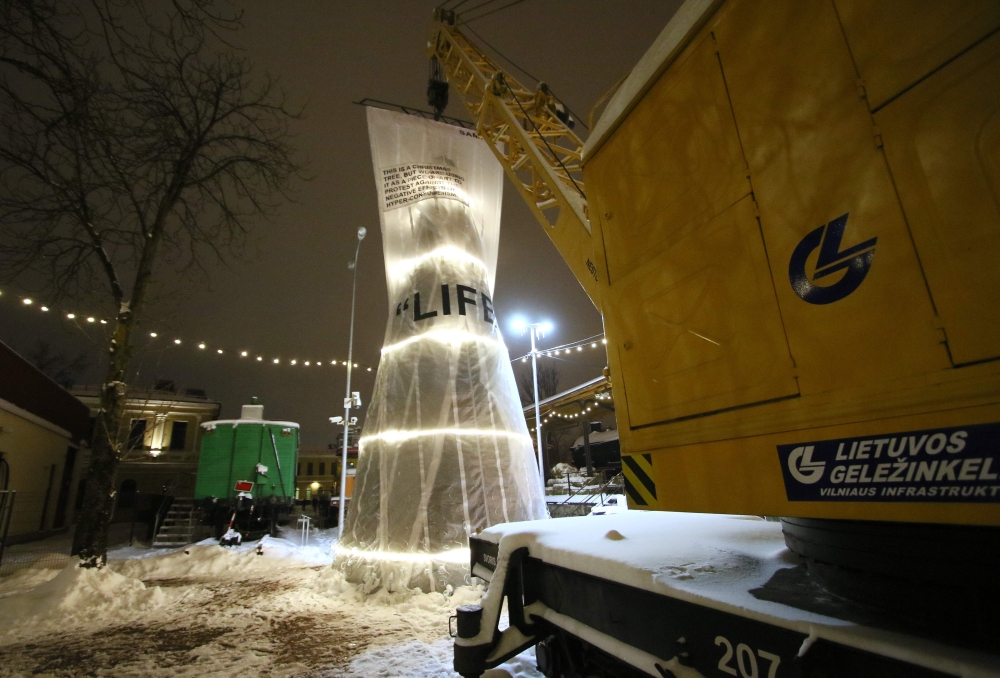 A wrapped Christmas tree can be seen at the Independent Christmas Town located at the Vilnius Railway Station in Vilnius, Lithuania, on December 19, 2018.  AFP / Petras Malukas 