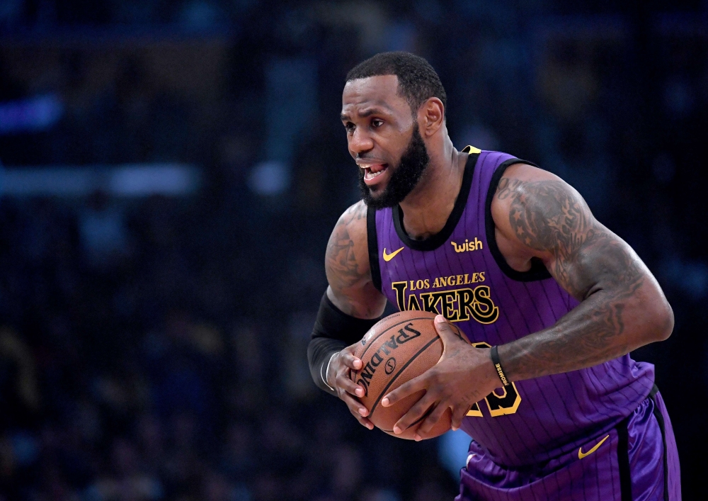 LeBron James #23 of the Los Angeles Lakers palms the ball before the game against the New Orleans Pelicans at Staples Center on December 21, 2018 in Los Angeles, California.  Harry How/AFP