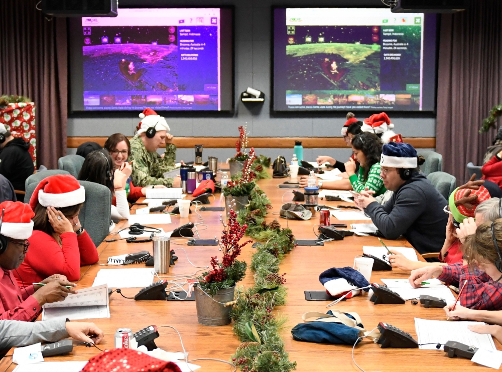 In this photo released by the US Airforce, volunteers work in the 2018 NORAD Tracks Santa Operation Center on Peterson Air Force Base in Colorado Springs, Colorado on December 24, 2018.  AFP PHOTO / US Airforce/ Staff Sgt. Alexandra M. Longfellow