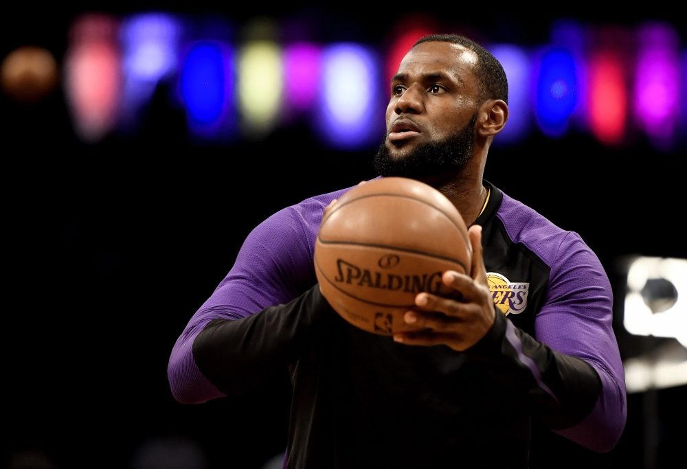 LeBron James #23 of the Los Angeles Lakers attempts a basket during warmups prior to the game against the Brooklyn Nets at Barclays Center on December 18, 2018 in New York City.  Sarah Stier/AFP 
