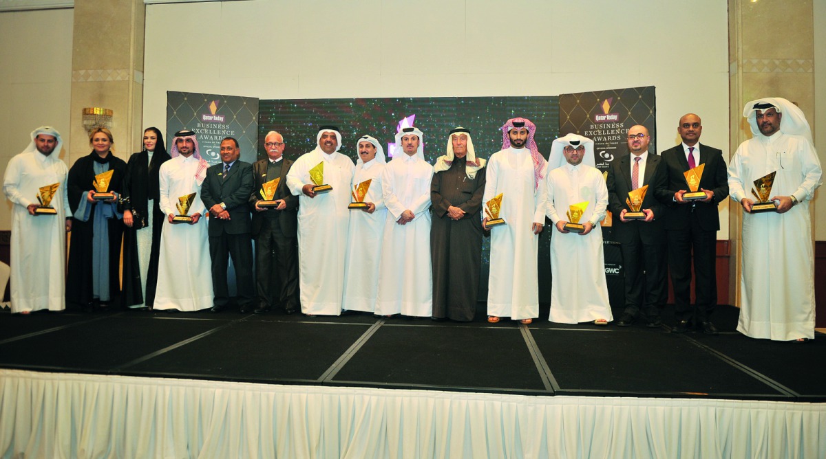 Yousuf Jassem Al Darwish, Publisher and Editor-in-Chief of Oryx Publishing and Advertising Co WLL, and Hussin Al Abdullah, Director of Marketing QSE, with the representatives of the winning firms during Qatar Today Business Excellence Awards held at Marri