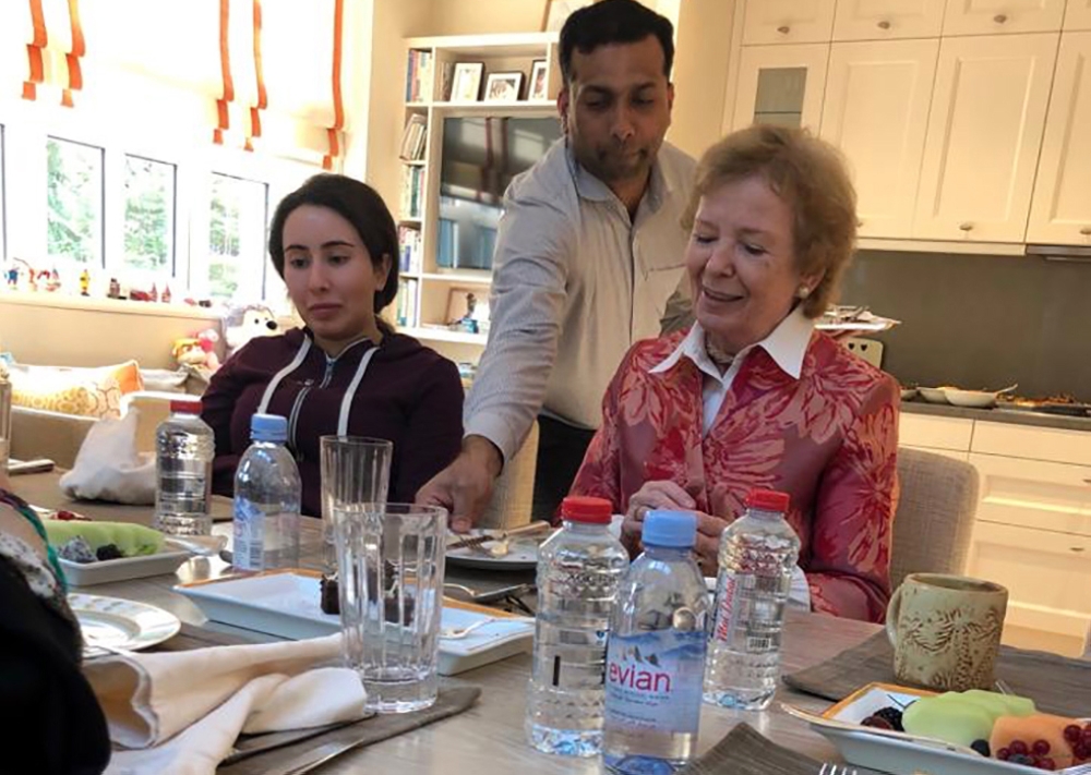 A handout image provided by United Arab Emirates News Agency (WAM) on December 24, 2018 shows Sheikha Latifa bint Mohammed bin Rashid Al-Maktoum (L) having a meal with Mary Robinson, former President of Ireland, at the Latifa's home in Dubai. AFP PHOTO / 