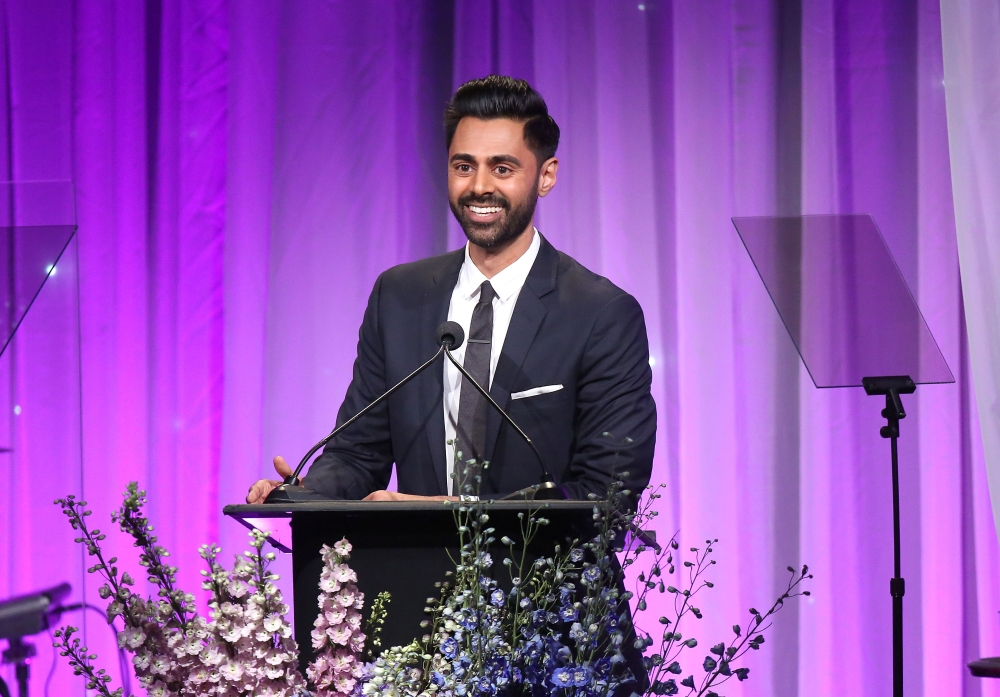 FILE PHOTO: Hasan Minhaj speaks during the Friends of The Saban Community Clinic's 42nd Annual Gala at The Beverly Hilton Hotel in Beverly Hills, California.   AFP / Jesse Grant