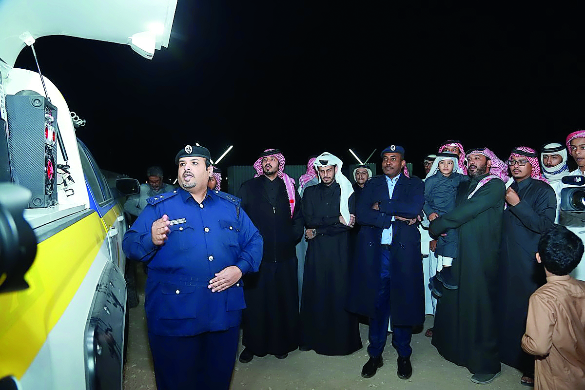 A traffic official giving demonstration at a winter camp site on traffic safety. 