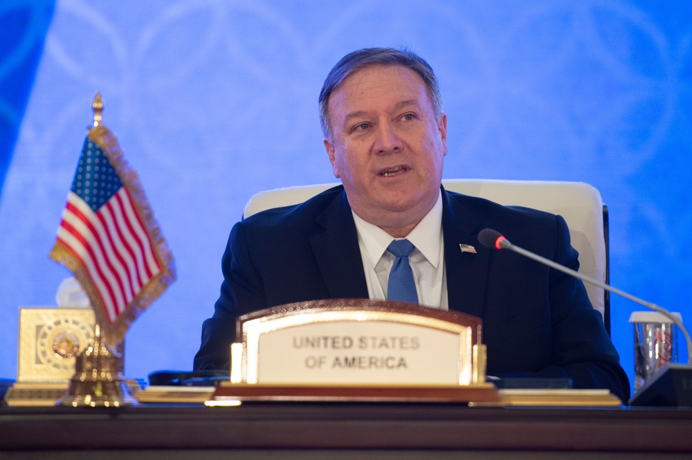 US Secretary of State Mike Pompeo signs an MOU and statement of intent with Mohammed bin Abdulrahman bin Jassim Al Thani, the Deputy Prime Minister and Qatari Minister of Foreign Affairs (not pictured), at the Sheraton Grand in the Qatari capital Doha on 