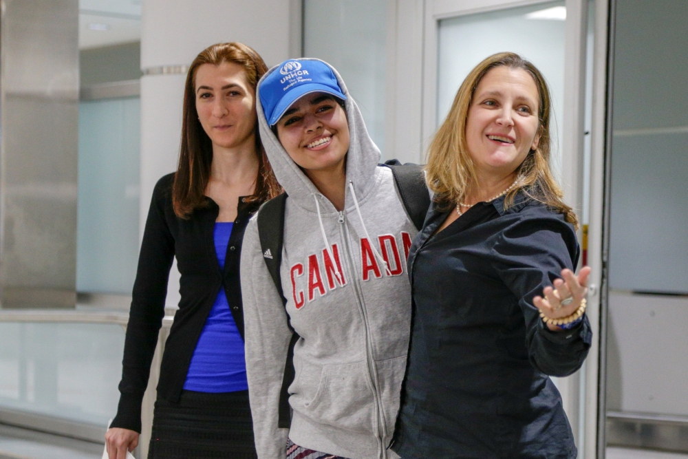 Rahaf Mohammed al-Qunun (C) accompanied by Canadian Minister of Foreign Affairs Chrystia Freeland (R) and Saba Abbas, general counsellor of COSTI refugee service agency, arrives at Toronto Pearson International Airport in Toronto, Ontario, Canada January 