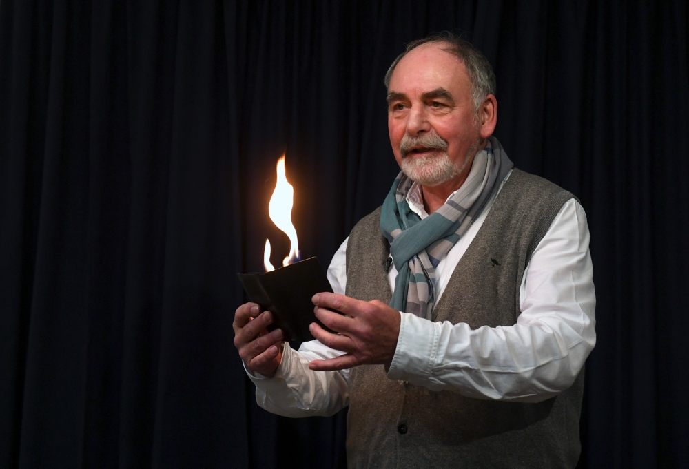 Harold Voit, owner of the Magic Academy in Pullach near Munich, southern Germany, performs on November 29, 2018. / AFP / Christof STACHE 