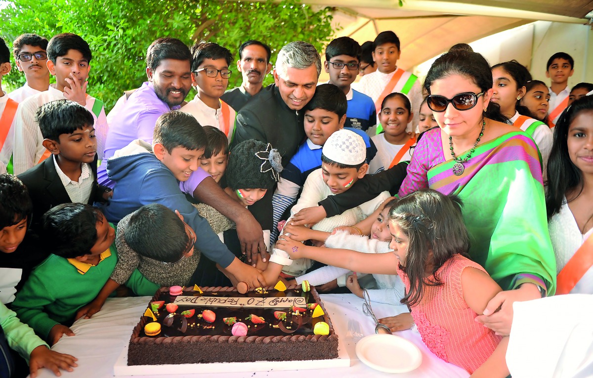 Indian Ambassador P Kumaran and his wife Ritu Kumaran cutting a cake along with children during the 70th Republic Day celebrations at the Indian Embassy yesterday. Pic: Abdul Basit  / The Peninsula