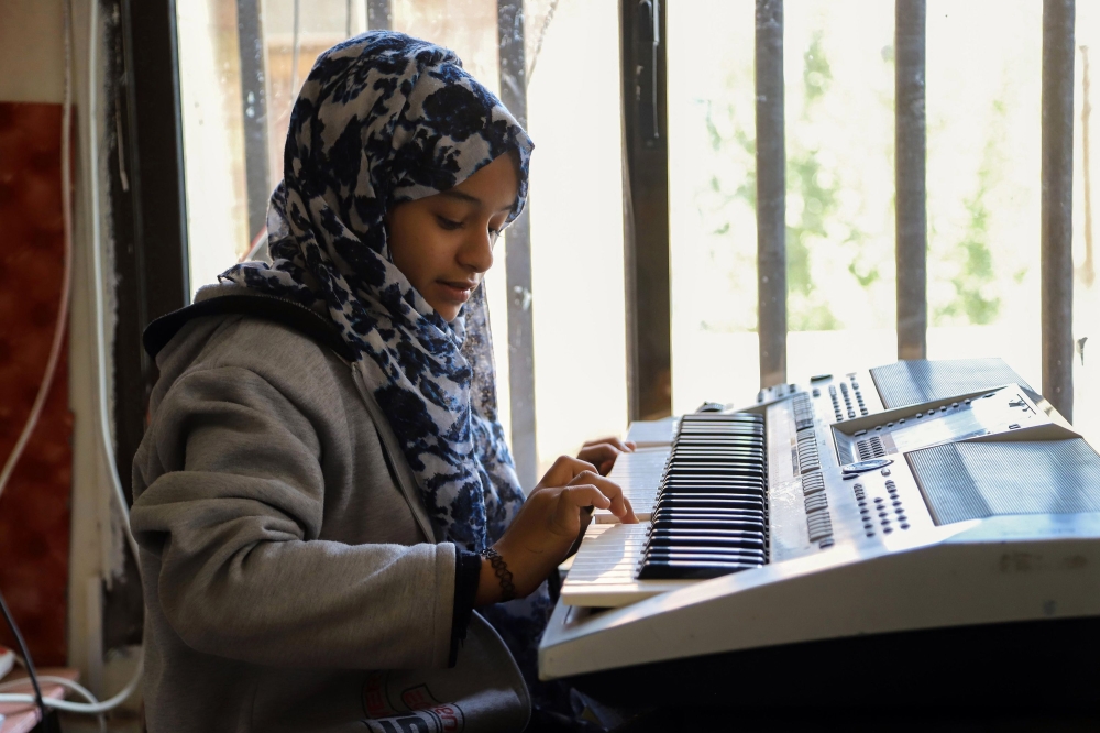 Children attend a music class at the Al-Nawras school in Taez, Yemen's third city, in the country's southwest, on January 23, 2019. AFP / AHMAD AL-BASHA