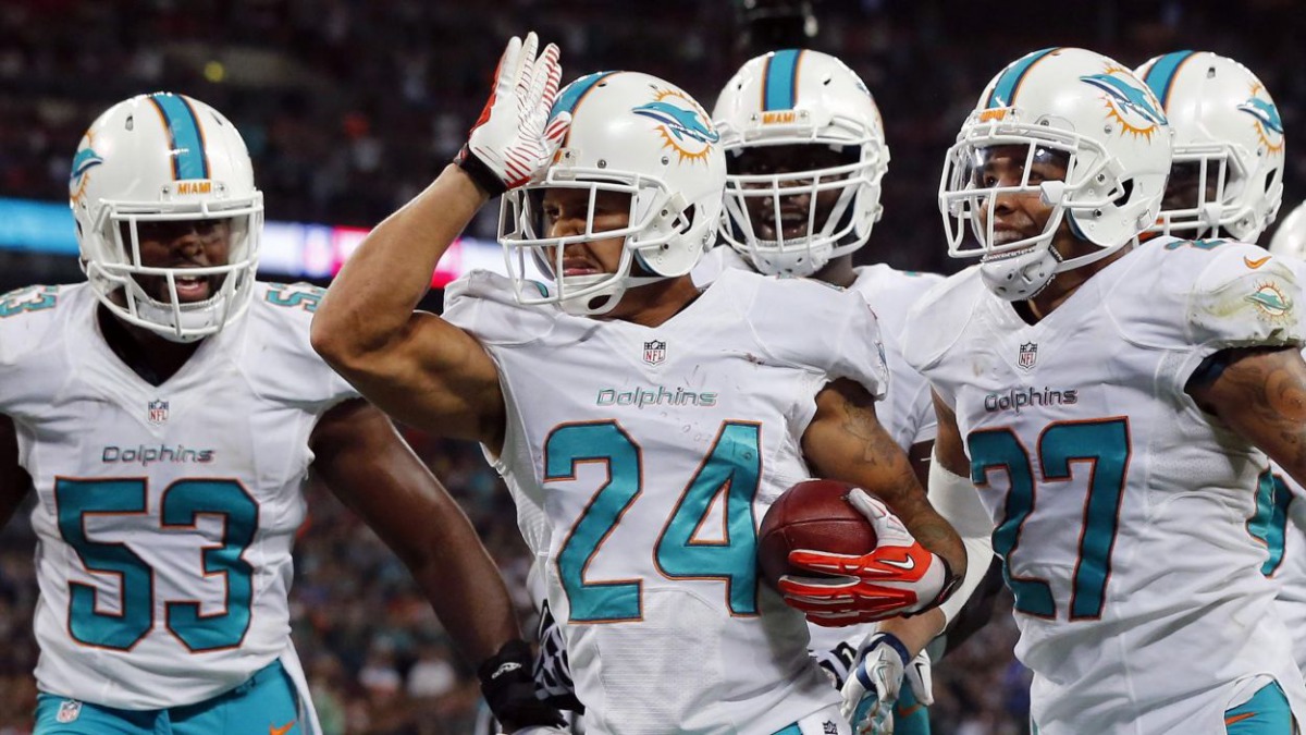 Miami Dolphins' Cortland Finnegan celebrates a touchdown against the Oakland Raiders during an  NFL football game at Wembley Stadium in London September 28,  2014. Reuters