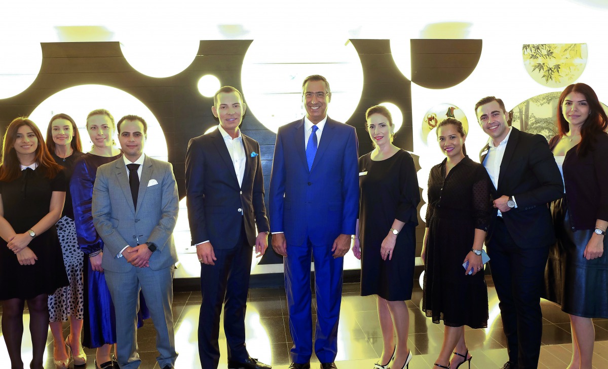 A group photo showing the Westin Doha GM Gianrico Esposito, and Daniel White surrounded by The Westin team and The Organic Pharamcy.