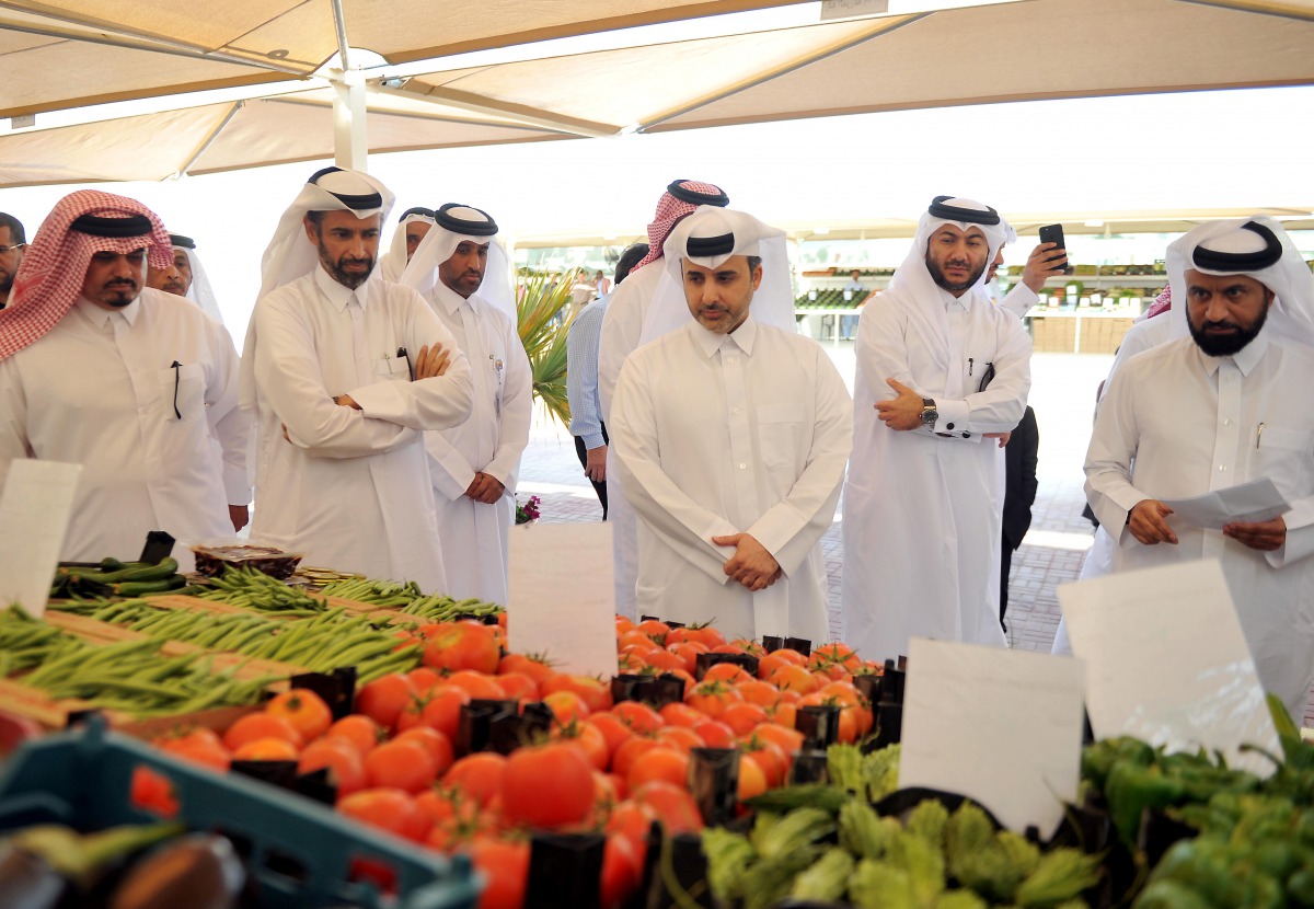 H E Abdullah bin Abdulaziz bin Turki Al Subaie (third right), Minister of Municipality and Environment, visiting a stall after inaugurating Al Shahaniya yard for local products, yesterday. Pic: Abdul Basit / The Peninsula