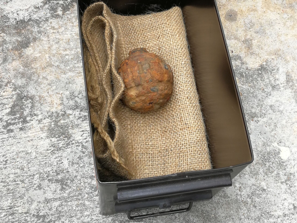 This handout photograph taken on February 2, 2019, and released February 3 by the Hong Kong Police Force shows World War I-era German hand grenade that was found among a shipment of French potatoes bound for a potato chips factory, in Hong Kong. 