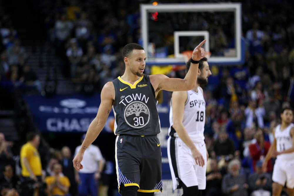 Golden State Warriors guard Stephen Curry (30) reacts after a Warriors basket against the San Antonio Spurs in the third quarter at Oracle Arena. Cary Edmondson