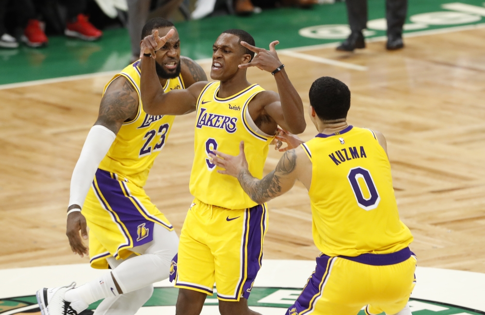 Los Angeles Lakers guard Rajon Rondo (9) reacts after making a game winning basket against the Boston Celtics in the fourth quarter at TD Garden. The Lakers defeated the Celtics 129-128. Mandatory Credit: David Butler II-USA TODAY Sports