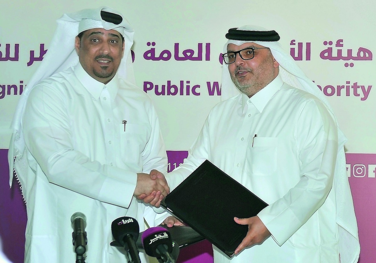 Dr. Ali Jassim Al Kubaisi (left), Acting Managing Director of Qatar Leadership Center, and Dr. Eng. Saad bin Ahmad Al Muhannadi, President of Ashghal, during the MoU signing ceremony at Ashghal Tower yesterday. Pic: Baher Amin / The Peninsula