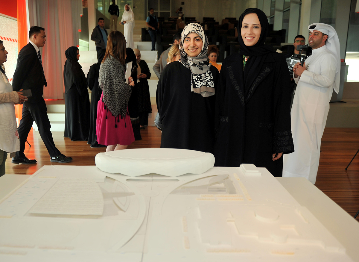 Buthaina Ali Al Nuaimi, (right) President, Pre-University Education (PUE) and Maryam Alhajri, Director, Academyati in front of the replica of the school at QF headquarters yesterday. Pic: Abdul Basit / The Peninsula