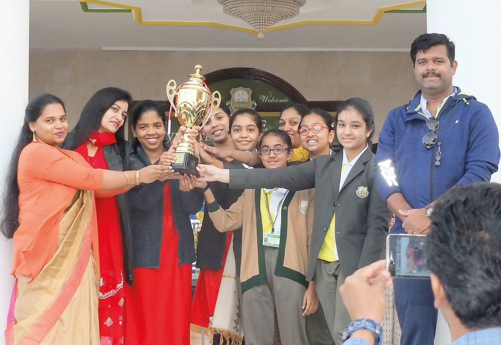 Students of Olive International School celebrating a victory.