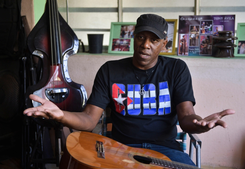 Cuban Singer and composer Tony Avila speaks during an interview with AFP in Havana, on January 20, 2019. AFP / YAMIL LAGE