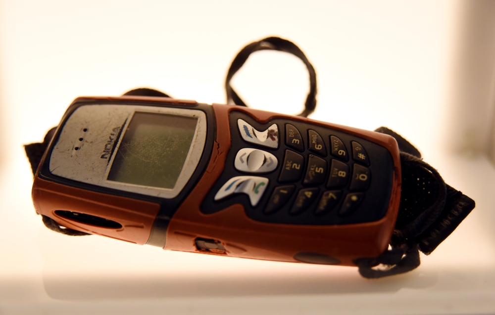 A picture taken at the Musem of Broken Relationships in Zagreb on February, 14, 2109 shows a mobile phone during an exhibition of personal objects and stories of heartbreak created by artists Olinka Vistica and Drazen Grubisic.  AFP / Denis Lovrovic 
 