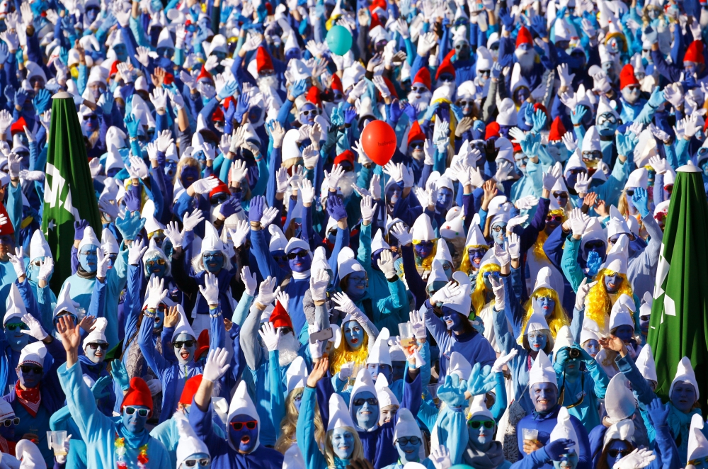 Participants dressed as smurfs celebrate after setting a new record for the world's largest meeting of smurfs in Lauchringen, Germany February 16, 2019. REUTERS/Arnd Wiegmann