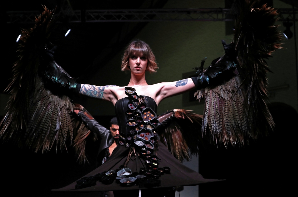 A model dressed in an outfit made with chocolate presents a creation at the 