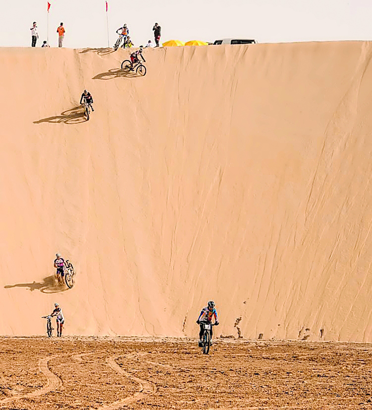 Cyclists crossing a sand dune during last year’s Al Adaid Desert Challenge in this file photo.