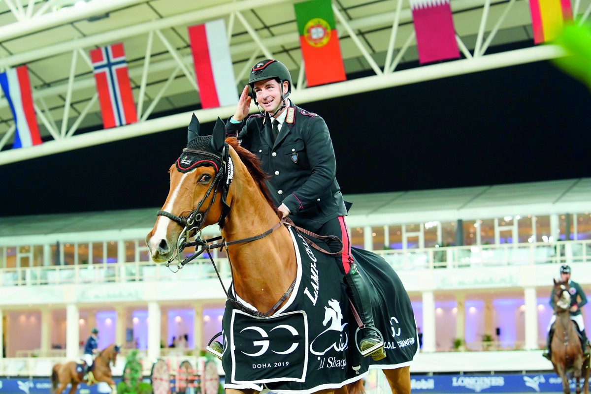 Italian rider Emanuele Gaudiano celebrates his victory astride Chalou on the opening day of the Longines Global Champions Tour - Doha event at the Al Shaqab Arena, yesterday. 
