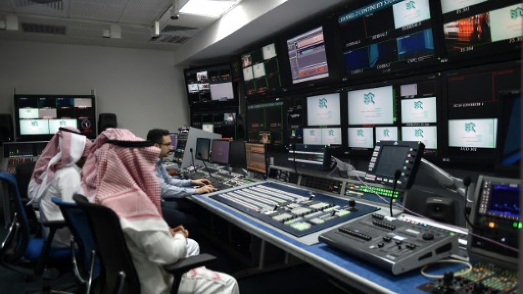  An employee works with trainees at SBC, a new channel under the umbrella of the Saudi Broadcasting Corporation in Riyadh, on April 24, 2018. AFP 