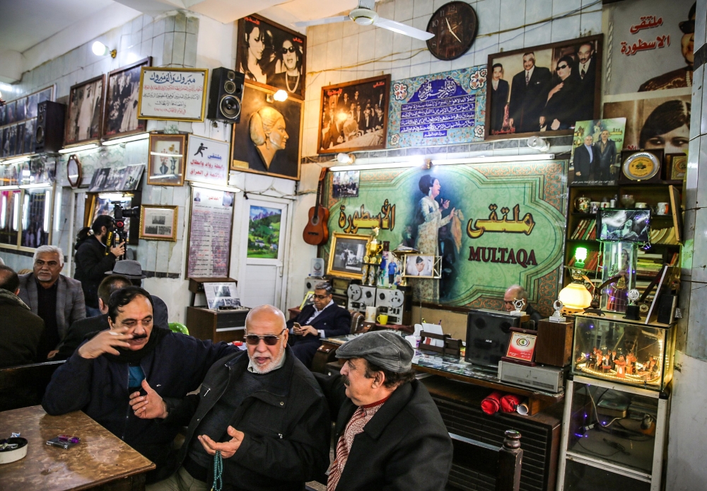 Iraqi men gather and socialise at Umm Kulthum Cafe on Rasheed street, the oldest street in the capital Baghdad on January 20, 2019. AFP / Sabah Arar