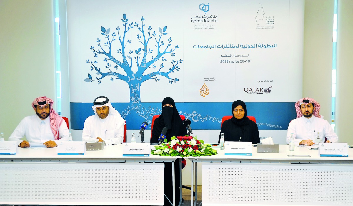 Dr Hayat Abdullah Maarafi (centre), Executive Director of QatarDebate, with other officials during a press conference held yesterday. Pic: Abdul Basit / The Peninsula