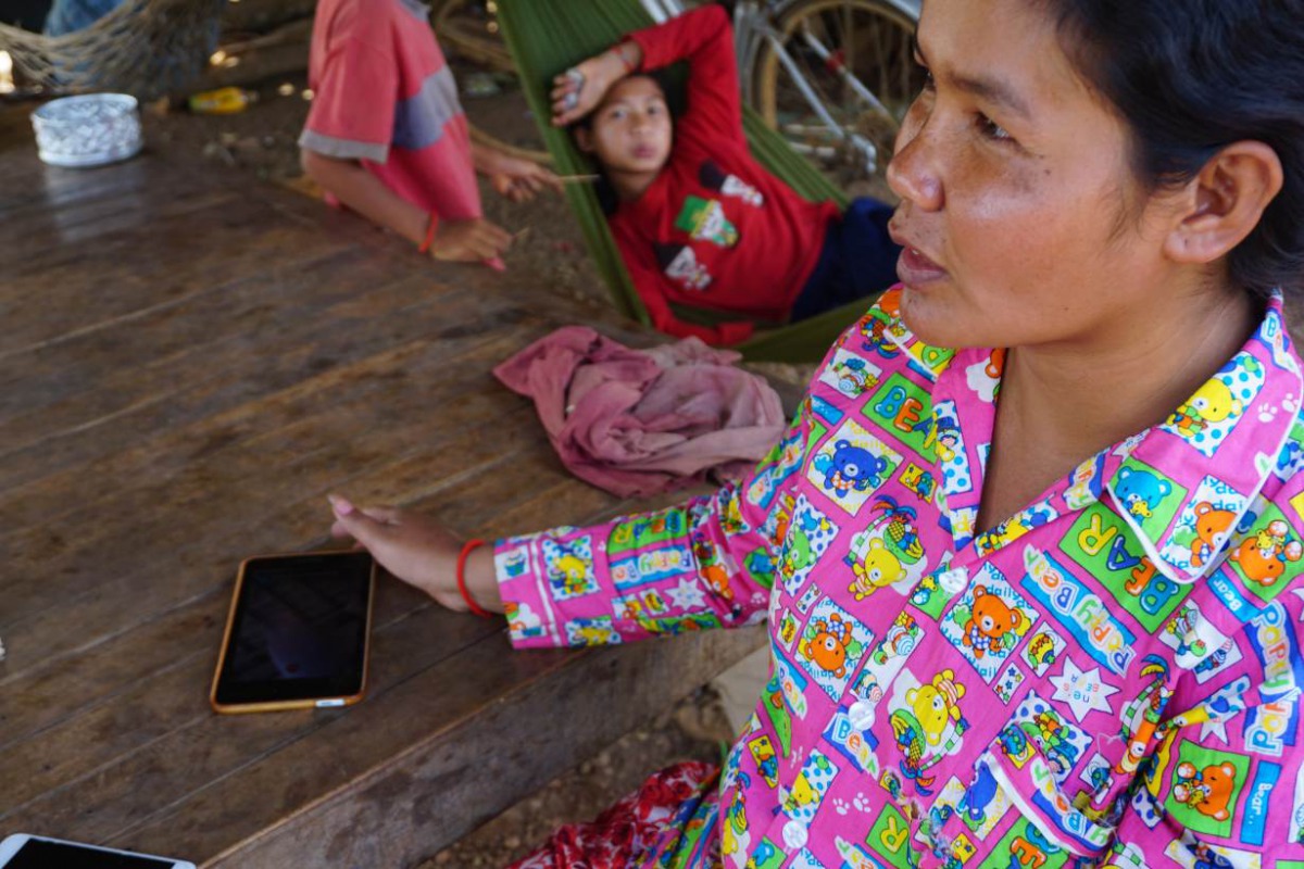 Ol En tells reporters about her failed attampts to contact her daughter in China, at her home in Kampong Cham province, Cambodia, February 18, 2019. Thomson Reuters Foundation/Matt Blomberg