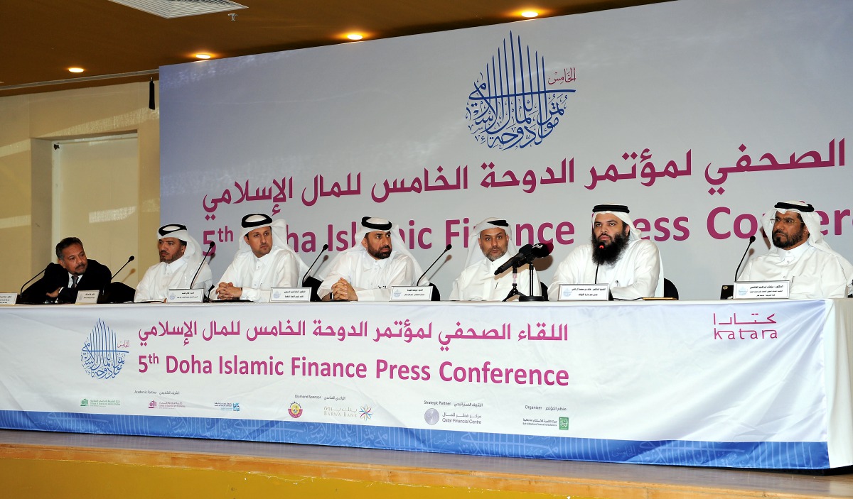 Dr Osama Qais Al Dereai (centre), Managing Director and CEO of Bait Al Mashura and organising committee Vice Chairman of the 5th Doha Islamic Finance Conference; addressing the media at the Katara in Doha yesterday. Pic: Salim Matramkot/The Peninsula 
