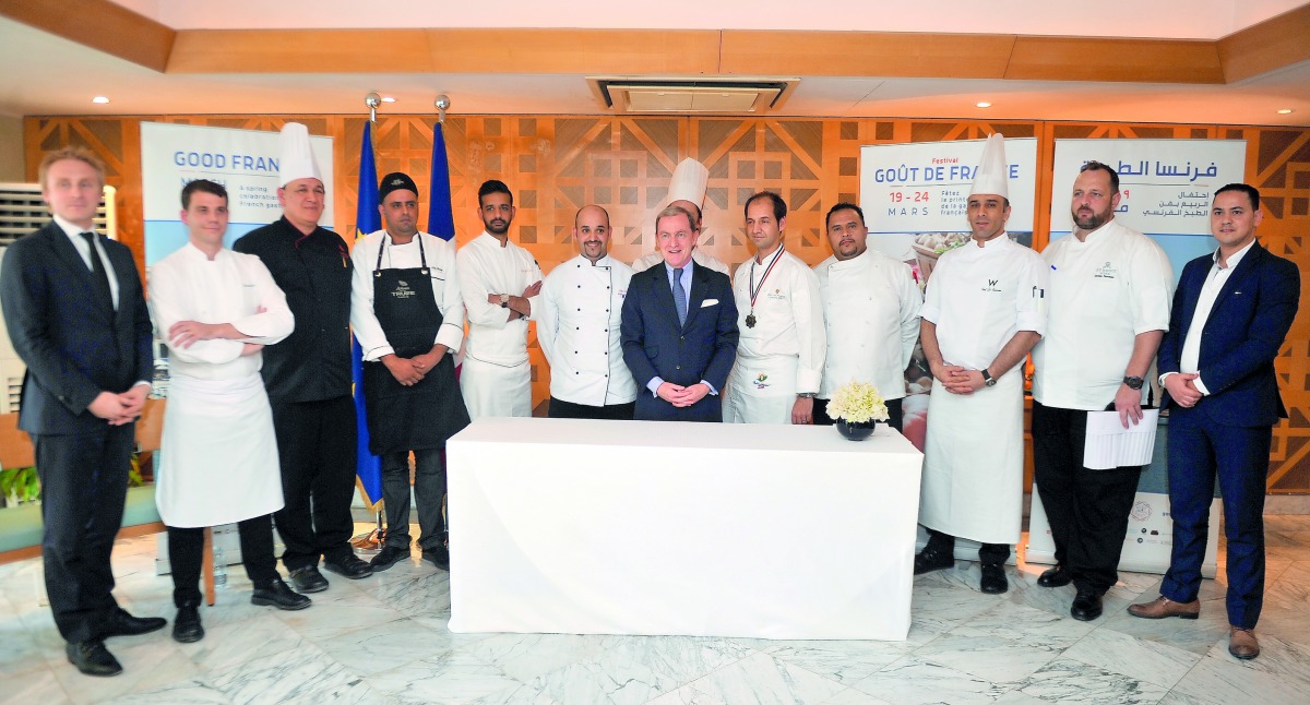 The Ambassador of France to the State of Qatar, Franck Gellet (centre), with chefs during the press conference at his residence, yesterday. Pic: Abdul Basit / The Peninsula