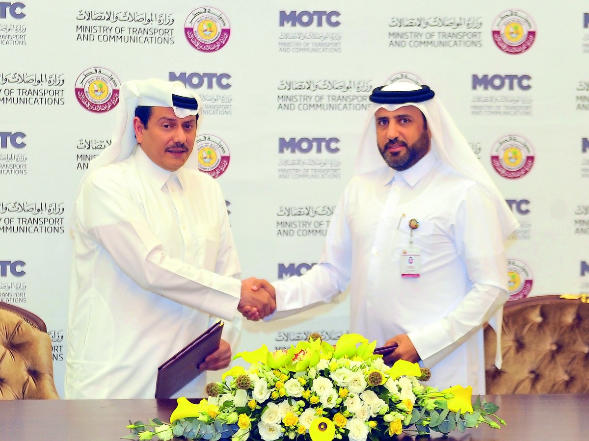 Rashid Taleb Al Nabet (right), MOTC’s Assistant Undersecretary of Land Transport Affairs, shaking hands with Badr Omar Al Mana, GBM Qatar Board Chairman, during the signing ceremony at Ministry of Transport and Communications yesterday. Pic: Abdul Basit /