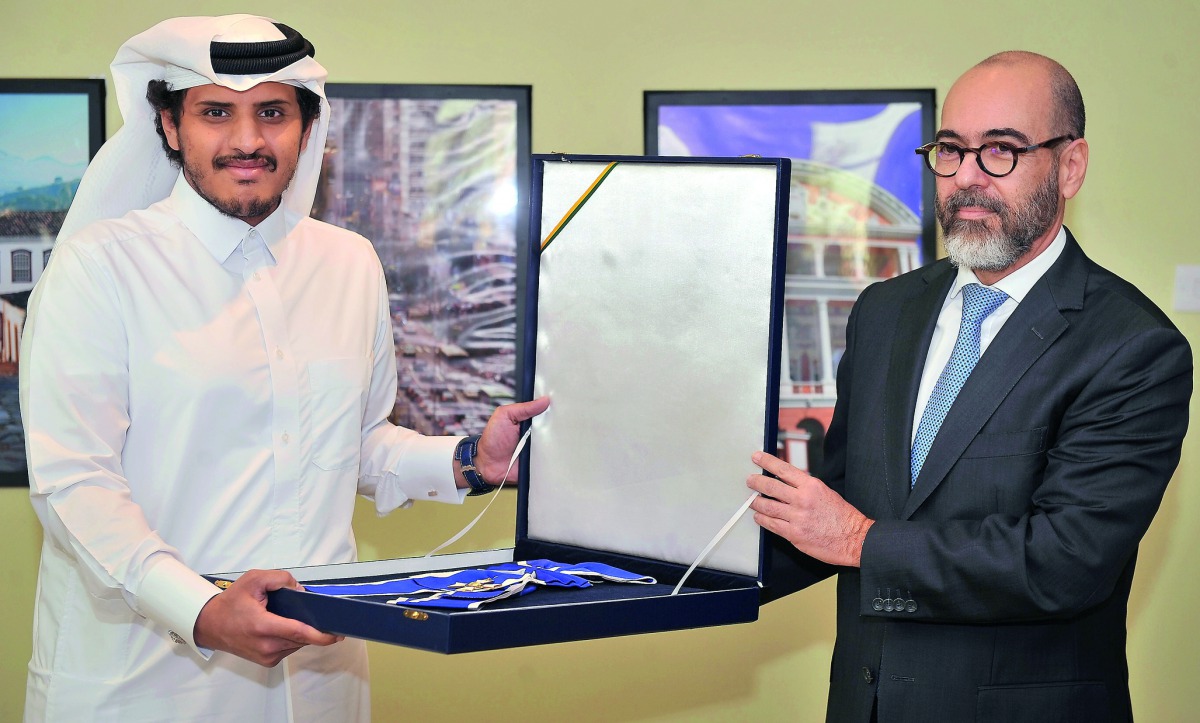 Sheikh Hamad bin Saoud Al Thani (left), the owner of Al Wabra Wildlife Preservation, receiving a token of appreciation from Roberto Abdalla, the Ambassador of Brazil to Qatar, during an event held at the Brazilian Embassy yesterday. Pic: Baher Amin / The 