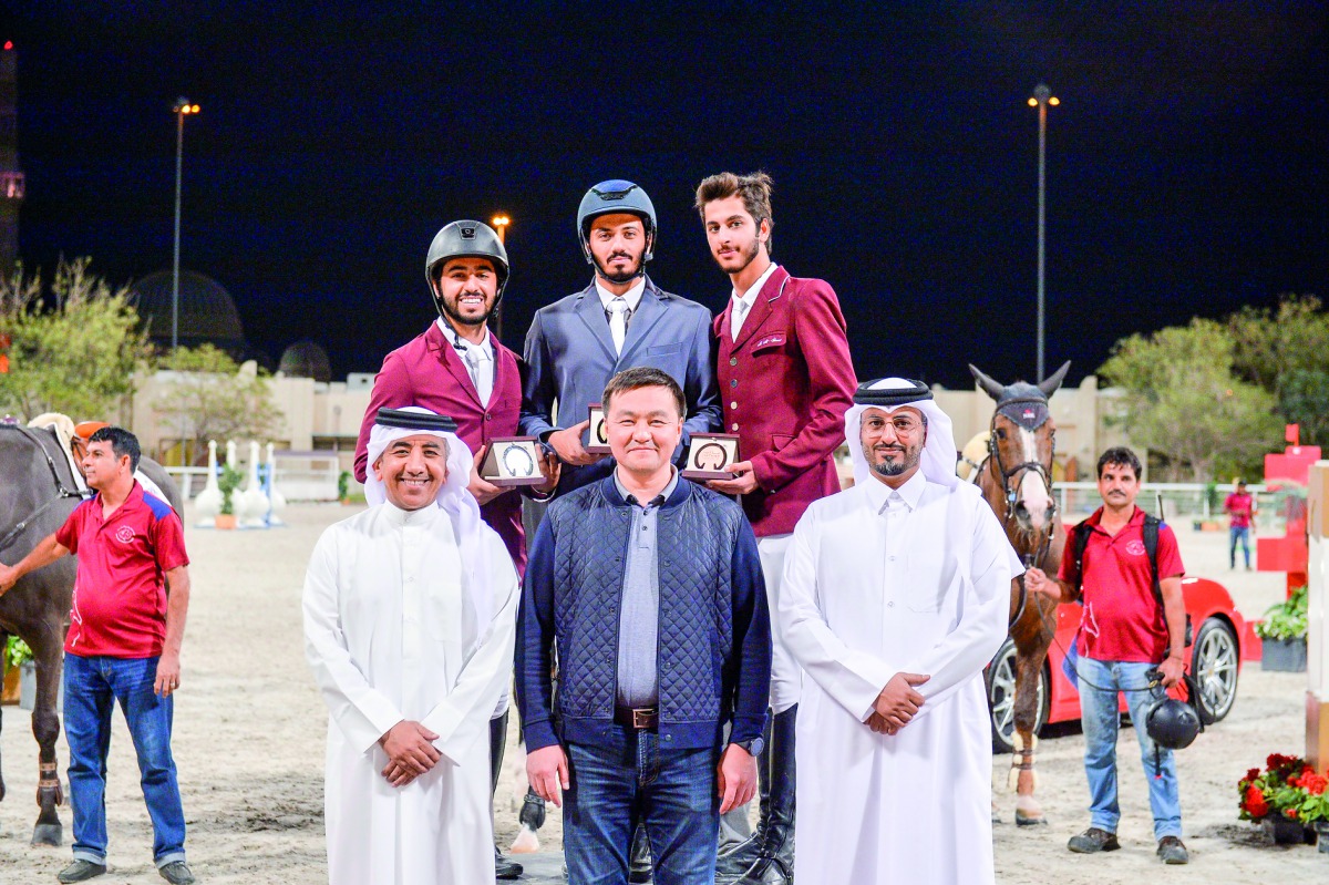  The Medium Tour podium winners pose for a photograph with officials during the opening day of the 10th Round of Hathab Series, yesterday.