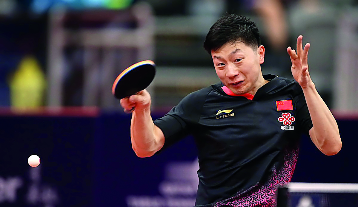 Chinese Olympic and World champion Ma Long in action against  Germany’s Timo Boll during their round of 16 match of the Seamaster 2019 ITTF World Tour Platinum, Qatar Open at the Ali Bin Hamad Al Attiyah Arena in Doha, yesterday.