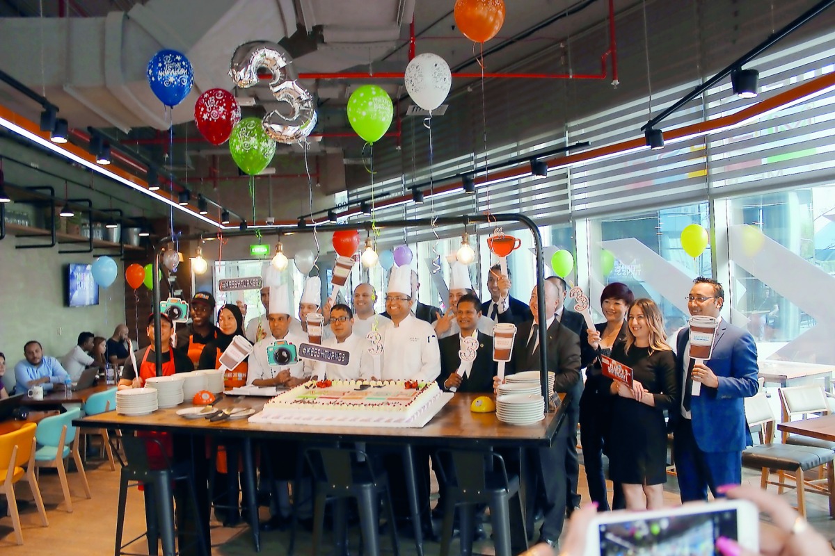 The officials and staff of Crowne Plaza Doha — The Business Park & Holiday Inn Doha, Mohamed Bin Hamad Holding Co, and Meesh Cafe during the 3rd anniversary celebrations of Meesh Cafe on March 25. 