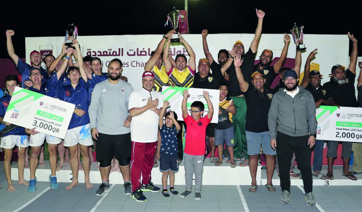 The podium winning teams at the Qatar Olympic Committee’s Winter Camp Multi Games Touch Rugby competition pose for a picture.